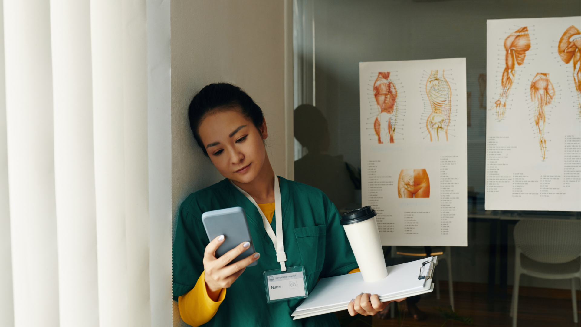 Nurse checking phone