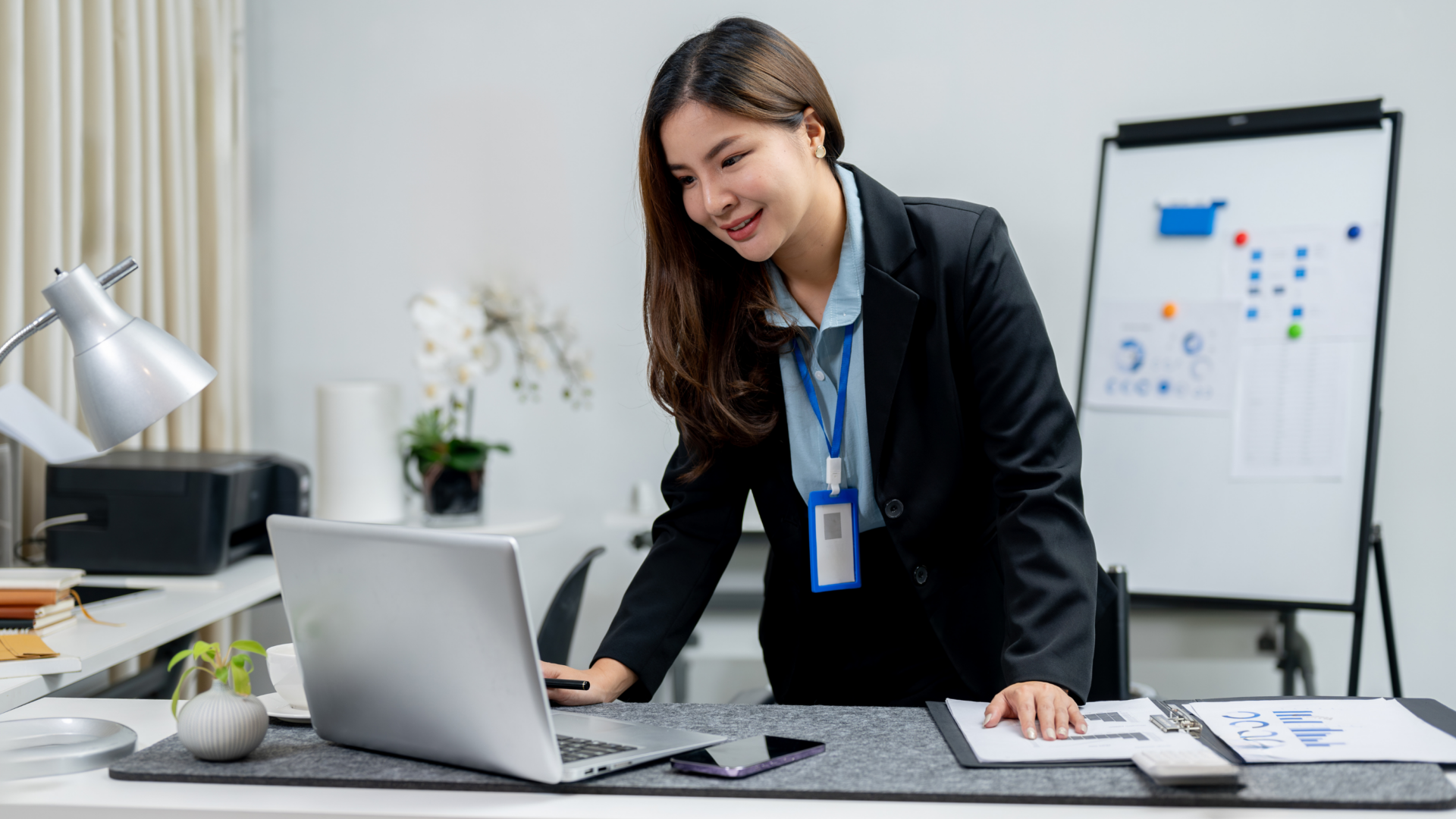 Headteacher checks intranet on desktop