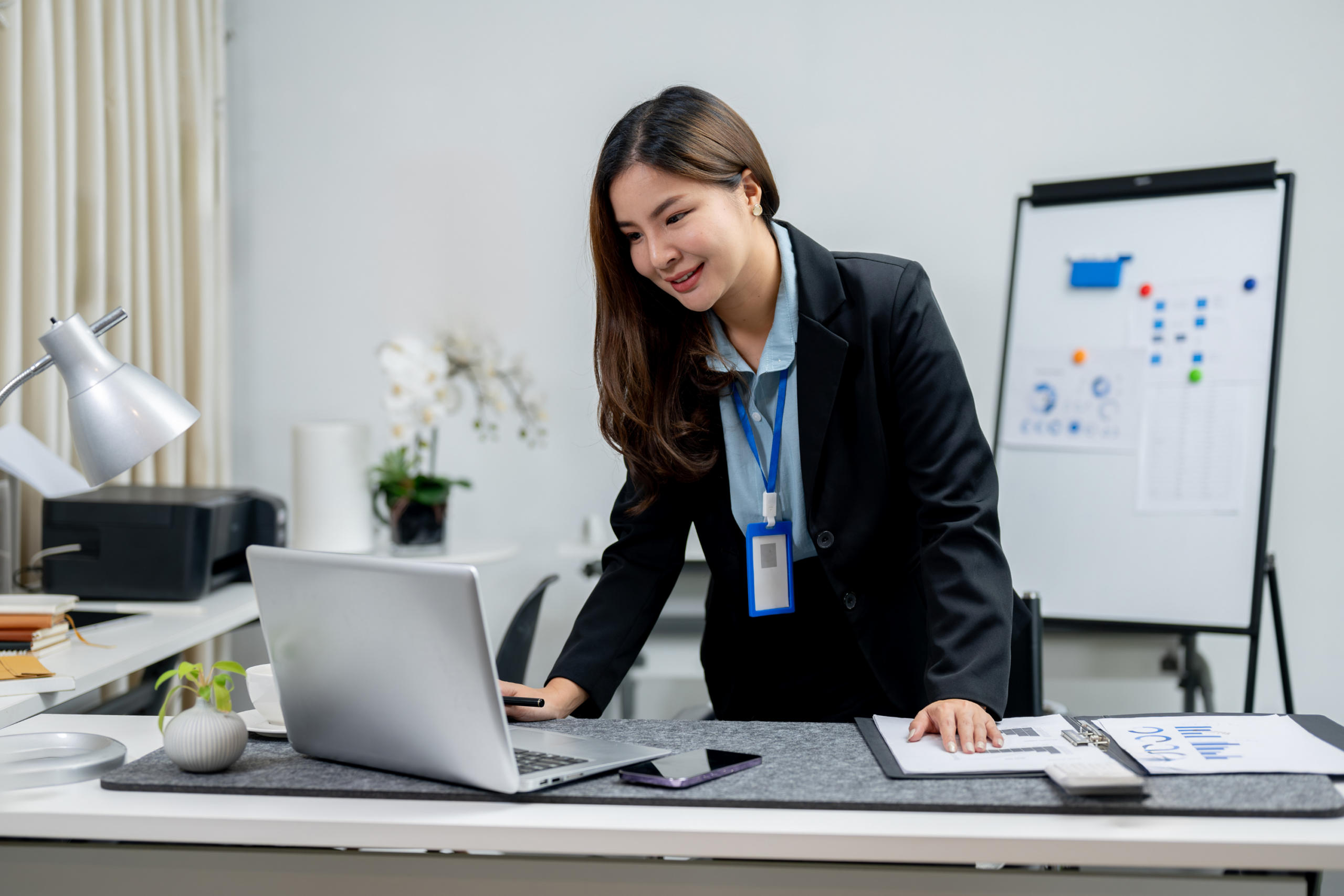 Headteacher checks intranet on desktop