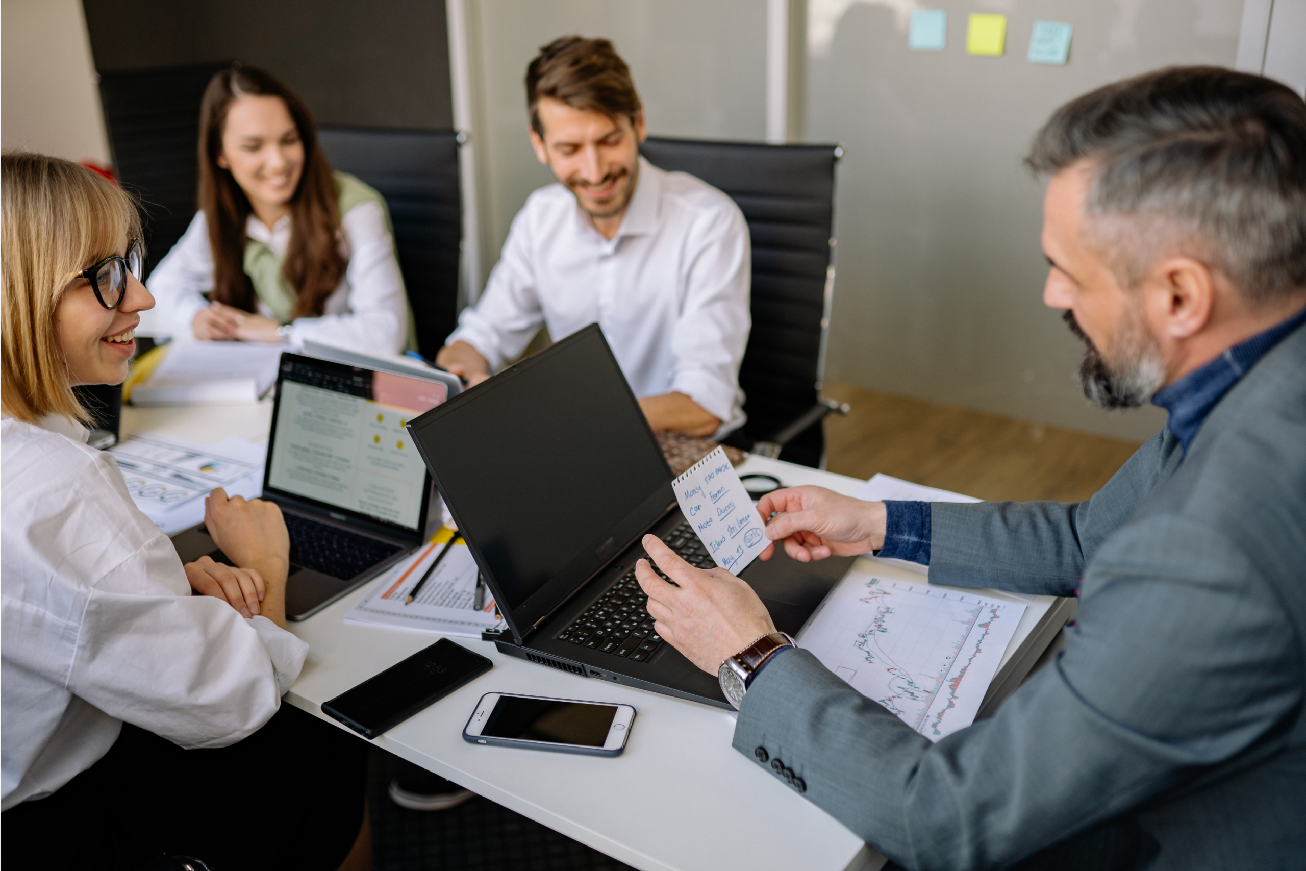 employees gathered around desk