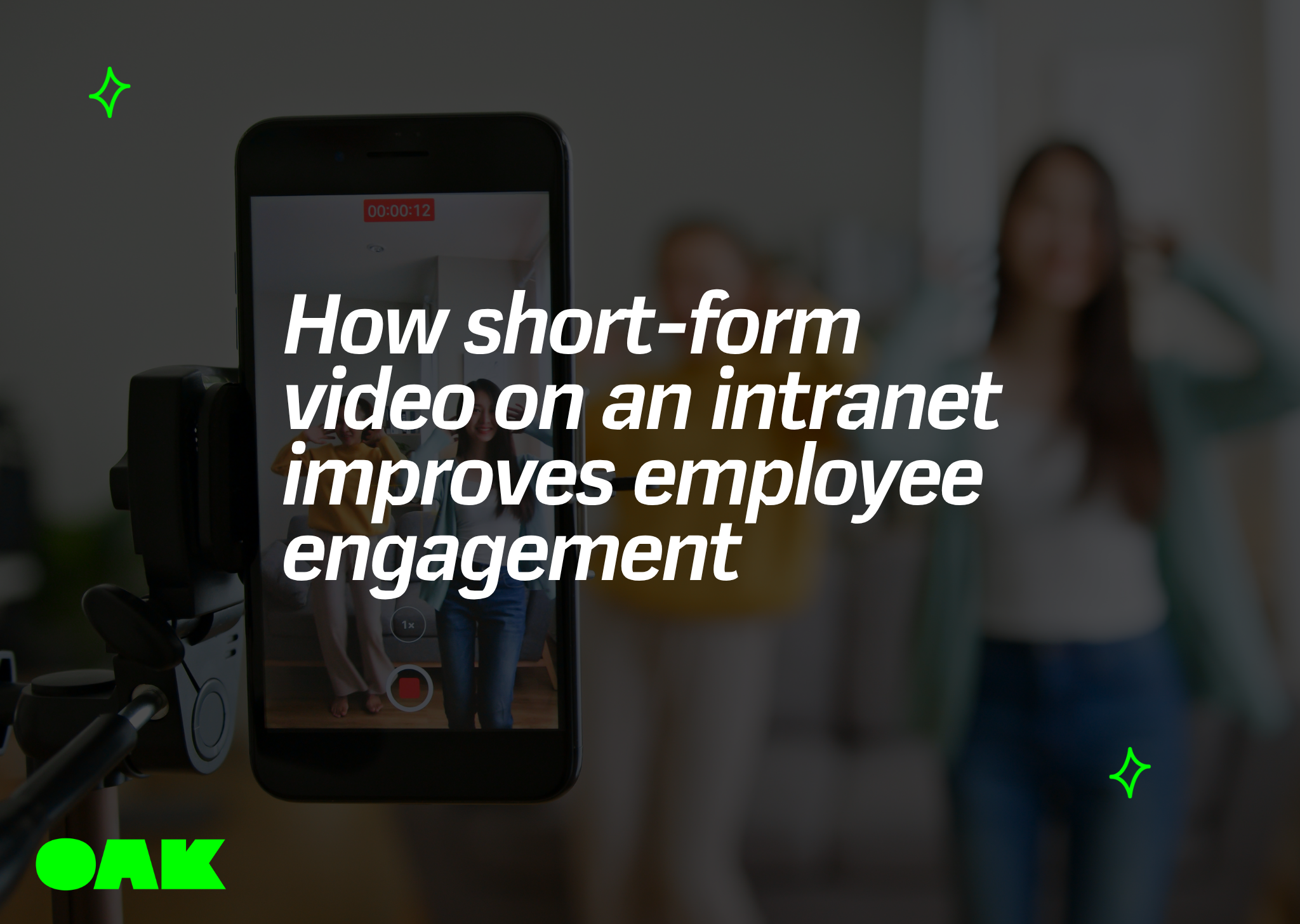 A smartphone mounted on a tripod recording a short-form video of people dancing in a room. The image features a dark overlay with the blog title text, "How short-form video on an intranet improves employee engagement," and the Oak logo in the bottom left corner.
